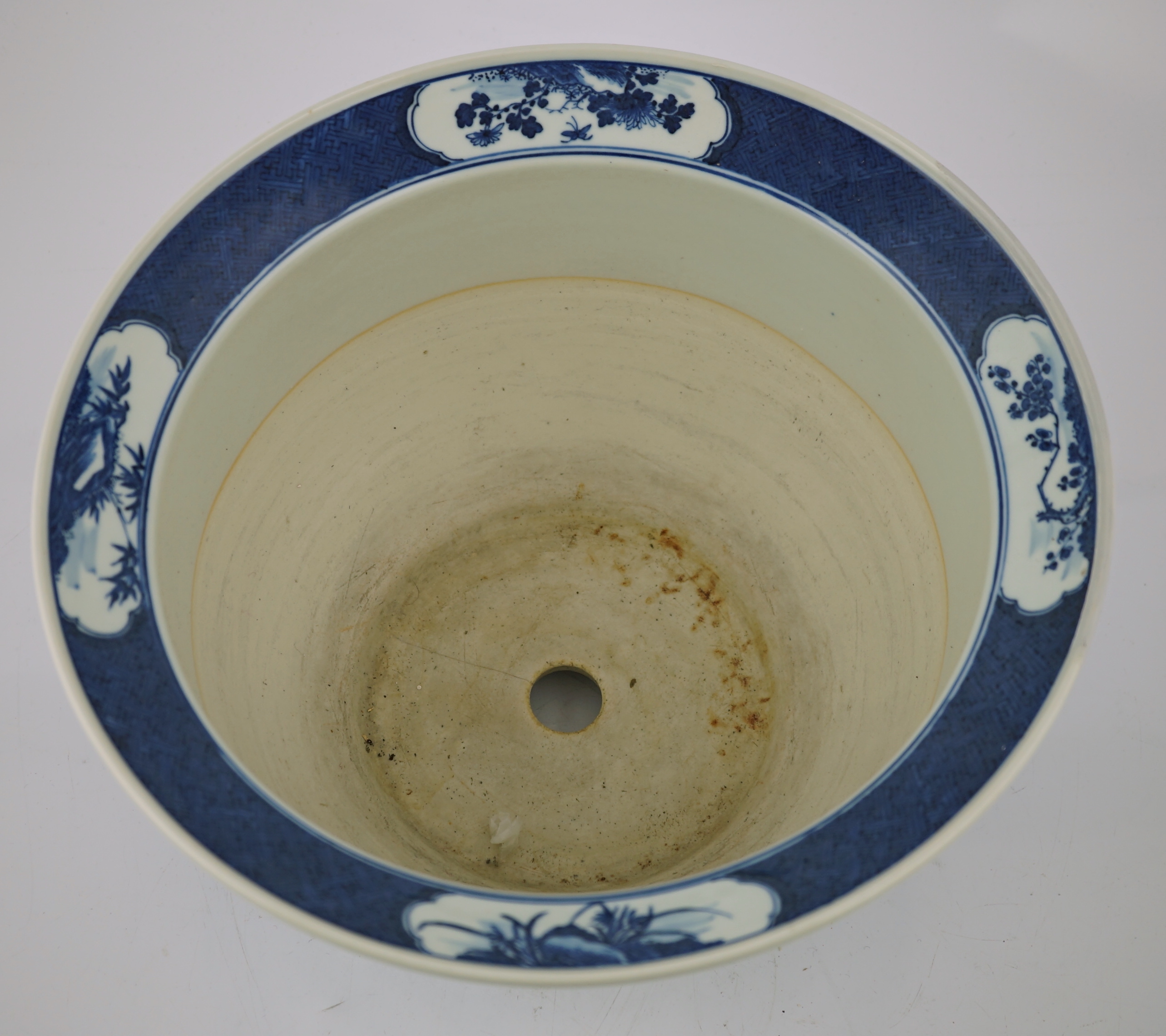 A Chinese blue and white 'deer and cranes' planter, 19th century, restoration to rim and a crack to the base